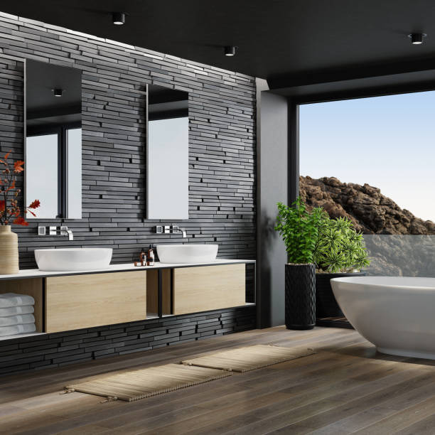 Modern bathroom with wood-look flooring, double vanities, and a bathtub | All Floors Design Centre