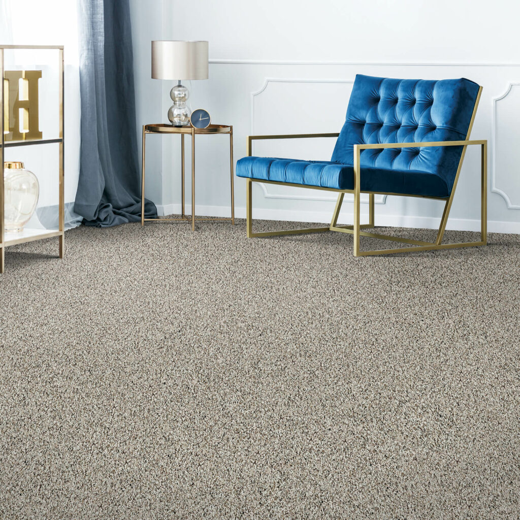 Carpet flooring in a stylish room with a blue accent chair | All Floors Design Centre