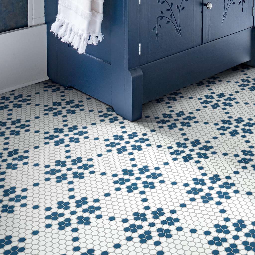 Blue and white patterned tile flooring beneath a dark blue cabinet | All Floors Design Centre