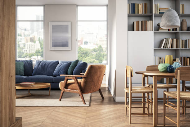 Modern living and dining room with wood flooring, blue sofa, and furniture | All Floors Design Centre