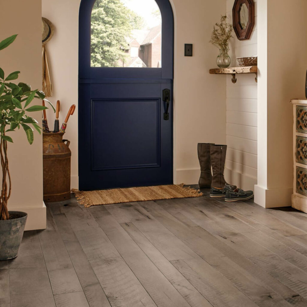Gray-toned hardwood flooring in a welcoming home entryway | All Floors Design Centre