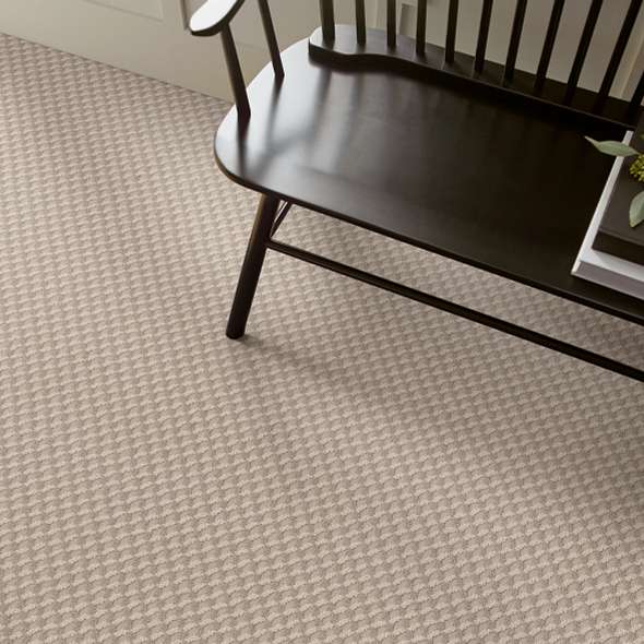 Textured carpet with a dark wood chair | All Floors Design Centre